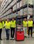 Fahrerloses Transportsystem Gruppenfoto mit Vorstand